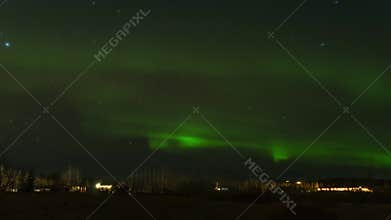 A timelapse footage Aurora also known as the northern lights dancing above winter Iceland. Unforgettable experience