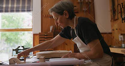 Female luthier at work in her workshop