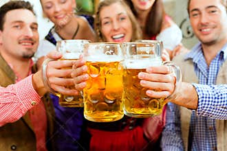 People drinking beer in Bavarian pub