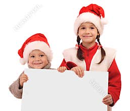 Little children in Christmas hats with banner