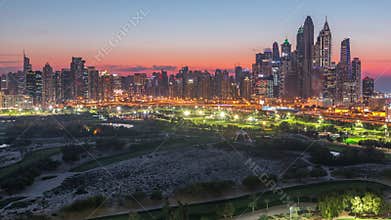 Dubai Marina skyscrapers and golf course day to night timelapse, Dubai, United Arab Emirates