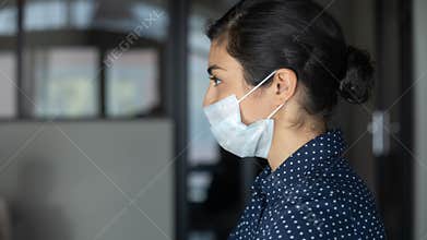 Cautious young businesswoman preventing spreading corona virus.