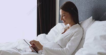 Smiling pretty lady chatting in social networks, dating online.
