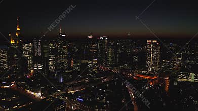 AERIAL: View of Frankfurt am Main, Germany Skyline at Nights with City Lights