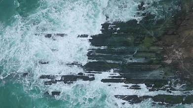 Amazing shot of the drone in the fall of Salalah, sea waves and rocks, Sultanate of Oman