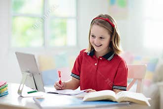 Online remote learning. School kids with computer