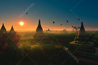 Bagan Myanmar Hot air balloons flying over stupas at Sunrise