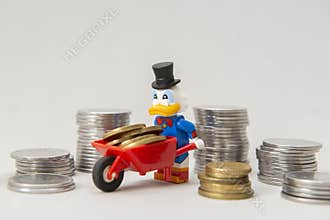 Scrooge McDuck carrying coins on a wheelbarrow on white background