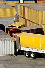Loading cargo containers from trucks