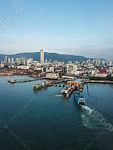 Aerial blue ferry arrive Penang Terminal.