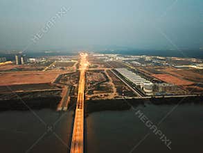 Drone view Dusk hour at Penang Second Bridge toward Batu Kawan town.