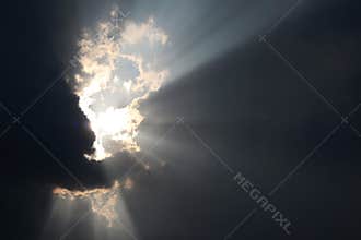 The light shone through from a dark cloud.