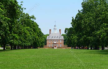 Williamsburg, Virginia - June 30, 2020 - The Governor`s Palace surrounded by green trees