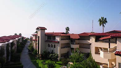 Beautiful resort hotel exterior with blue sky in the background.