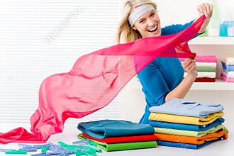 Laundry - woman folding clothes
