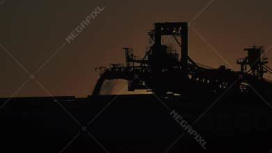 Shiploader loading iron ore filled into a ship