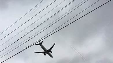 Commercial airplane flies over a house in Sydney Australia