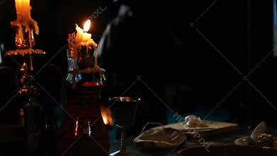 Reflected fireplace light in a mask of a plague doctor.