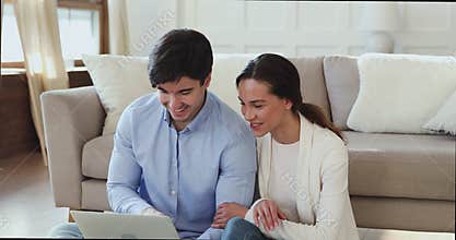 Happy married couple booking hotel or flight tickets online.