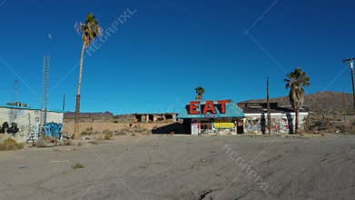 Aerial abandoned ghost town restaurant and gas station Halloran Springs 4K