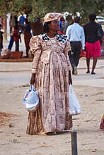 Opuwo, Namibia - Jul 06, 2019: Herero Woman in traditional clothes in Opuwo. Namibia