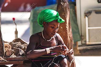 Opuwo, Namibia - Jul 07, 2019: Namibian woman on the street, seen in Opuwo, capital of the Kunene Region in Namibia