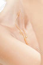 Neck of a beautiful girl with honey treatment