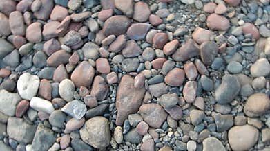 A lot of stones lie organized by the texture