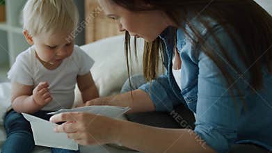 Tracking right video of mother and son browsing ultrasound images
