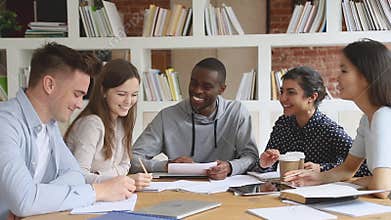Happy multiethnic diverse college university students team study together
