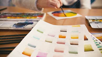 Artist workplace paint swatch hand color wheel
