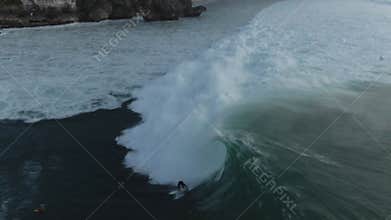 Aerial View Of Group Of Surfers In Ocean In Bali, Indonesia. People Surfboarding.