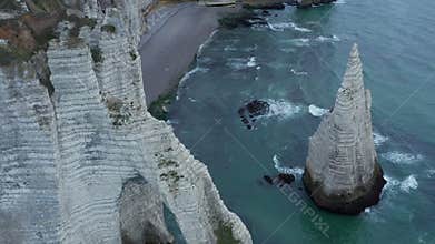 Incredible Aerial Overhead Aerial View of Etretat Cliff Arch in France with Sea Gulls Flying by