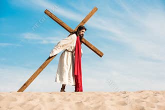 Jesus in wreath walking with cross