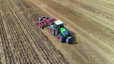 Aerial view of a Fendt tractor cultivating the land