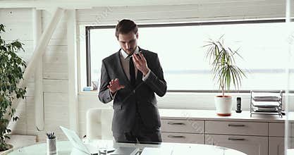 Concentrated executive ceo manager in suit dictating message to client.