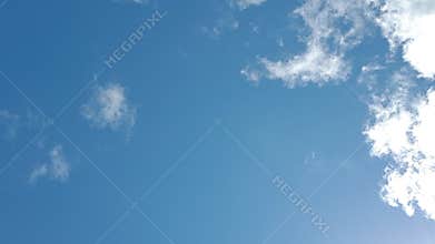 Blue summer Clouds on a clear sky in movement