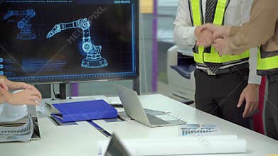 The engineering team is brainstorming to help plan a successful machine building.