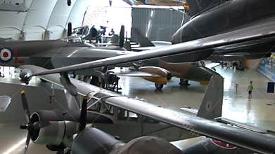 Historical airplanes on display at the main hangar of the RAF museum in London.