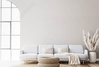Scandinavian living room design with rattan table, pampas and white sofa on beige background