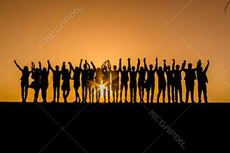Silhouettes of children against the sunset with their hands up. Goodbye school. Prom. Banner. A place for text. Photo in the