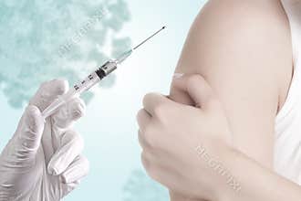 Hand holding a syringe with covid-19 vaccine