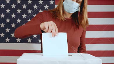 Woman with face mask voting