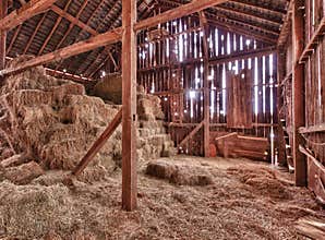 Interior of old barn with straw bales