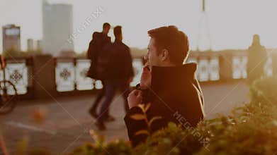 Handsome Man Sit and Speak By Phone .
