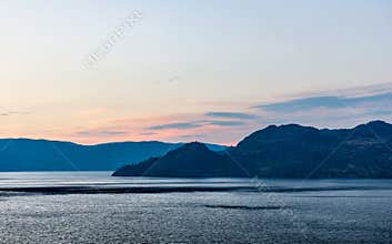Cloudy sky seen from the shore of Okanagan lake at night British Columbia Canada