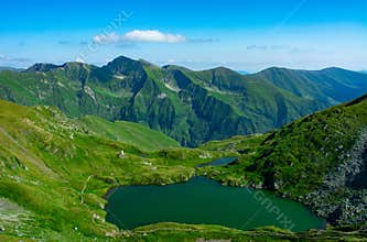 Balea Lake  with Fagaras mountain in Sibiu, Romania