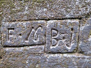 Engraved numbers and letters indicating the owner