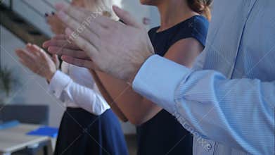 Business partners hands applauding at meeting