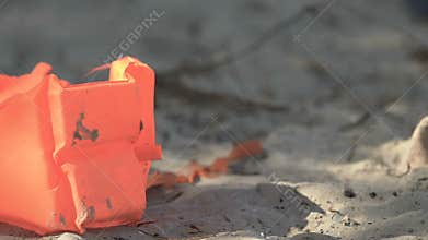 Life vest on abandoned beach, death after plane crash or shipwreck, catastrophe